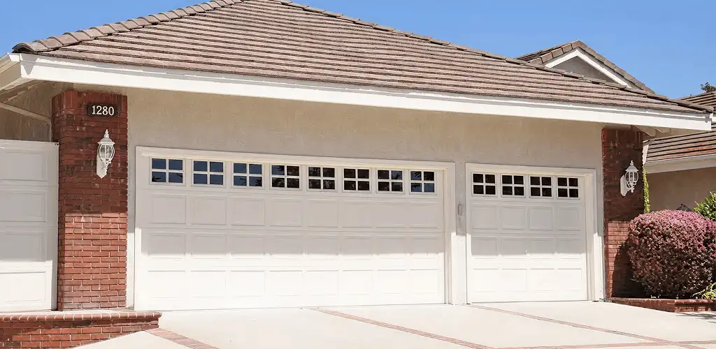 Residential garage door repair service for a double garage door in Lakewood, CO