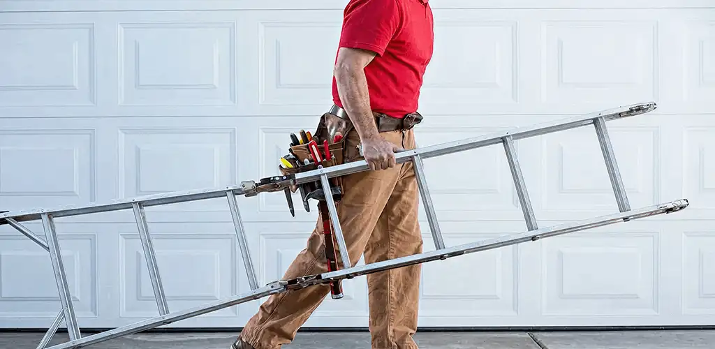 Garage door repair technician arriving with tools and ladder in Lakewood, CO