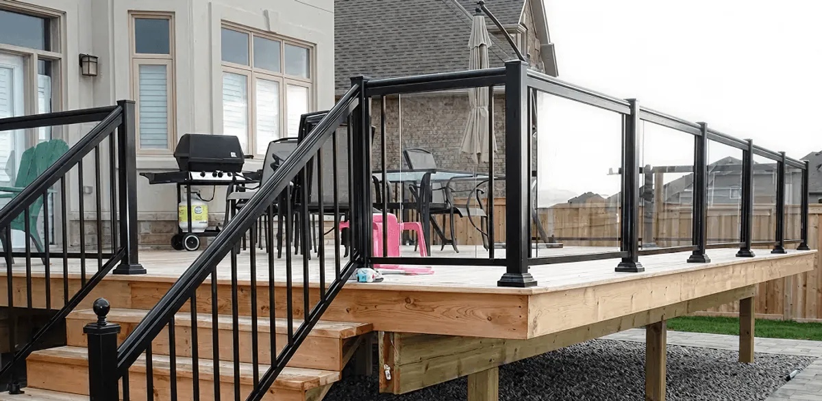 Handrail installation on a deck staircase for safety and code compliance in Lakewood, CO