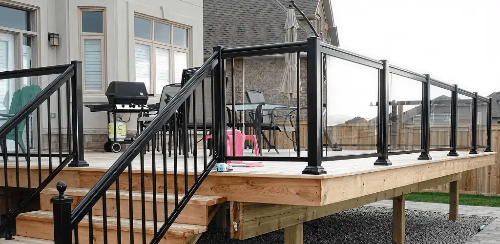 Handrail installation on a deck staircase for safety and code compliance in Lakewood, CO